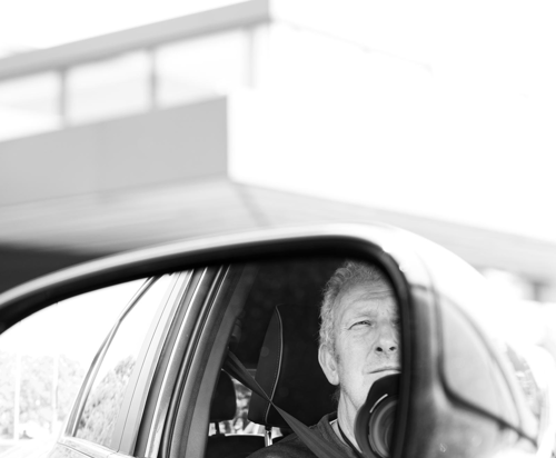 Brian Carroll dace in an open car window